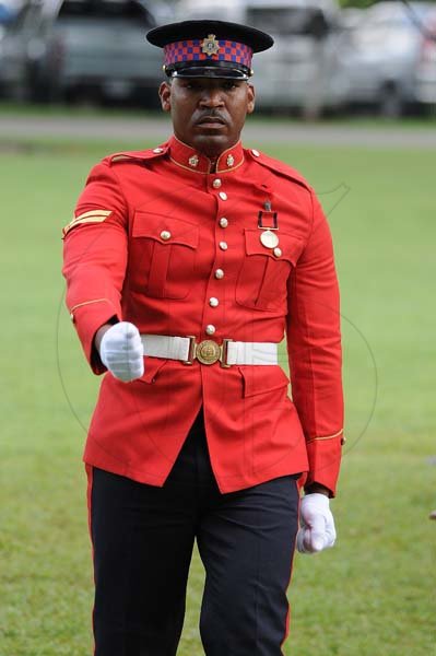 Lionel Rookwood/PhotographerCpl.Malachi Davis walks back after being presented the Badge of Honour for Gallantry at the Presentation of National Honours and Awards held at King's House on October 15th,2018.