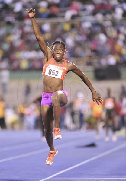 Ricardo Makyn/Staff Photographer
Kimberly Williams competes on the way to winning the women's long jump final at the JAAA/Supreme Ventures National Senior Track and Field Athletics Championships at the National Stadium on Sunday.