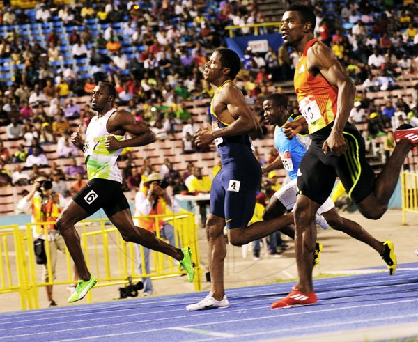 Usain Bolt winning heat one of the Mens 100 Meter