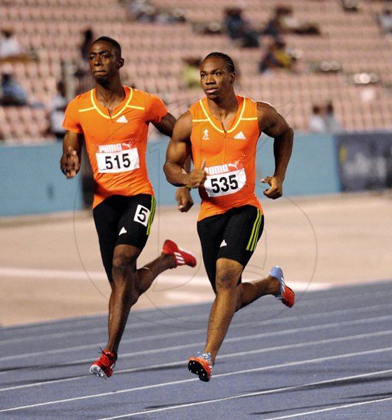 Kemar Bailey-Cole runs with Yohan Blake in Heat two of the Mens 100
Quarter Finals