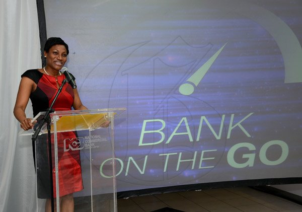 Winston Sill/Freelance Photographer
BUSINESS DESK:----- National Commercial Bank (NCB) official launch  of it's Bank of the future project, "Bank On The Go", held at the New Kingston Branch, Knutsford Boulevard  on Thursday night January 16, 2014. Here is Audrey Tugwell-Brown??.