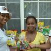 Ian Allen/Staff Photographer
Diana Birch right, Coordinator for Brand Promoters  presents Annette Piper centre with a gift during the Nestle Knock at the Gate promotion in Boone Hall Golden Spring St.Andrew. Looking on is Kemesha Hutchinson also of Nestle.