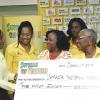 Ian Allen/Photographer
Carlene Edwards left, Sponsorship and Public Relations Manager, Supreme Ventures Limited presents the sponsorship check to Natalie Neita-Headley  centre, Minister without Portfolio with Responsibility for Sports, Marva Bernard (front left)President of the Jamaica Netball Association, Nadine Byran right, Co-Captain for the series,  Sasha-Gaye Lynch second right,  Malysha Kelly centre and Oberon Pitterson-Nattie Coach of the Sunshine Girls. Ocassion was the launch of the Supreme Ventures Sunshine Series between the Sunshine Girls and the English Roses. The launch was held at the Courtleigh Hotel in Kingston on Tuesday.
