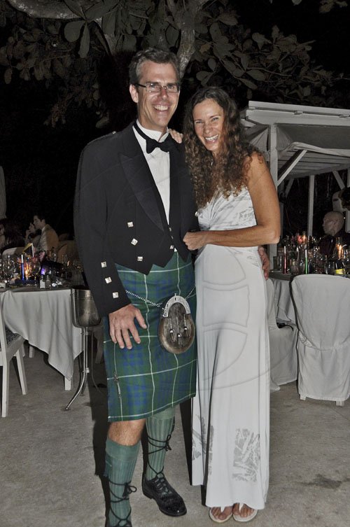 Janet SIlvera Photo
The jury may still be out on the outfit of choice for Sandals Resorts International's Richard Hamilton as he dons his Irish kilt and  poses with his wife attorney-at-law  Jacqueline as they welcomed 2012 at the Round Hill Hotel and Villas annual New Year's Eve Ball.


 last Saturday night.