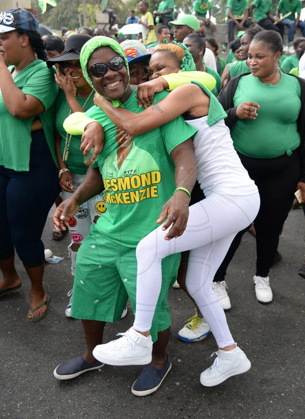 Jermaine Barnaby/Photographer
Desmond Mckenzie with some supporters on Spanish Town road on Tuesdayy February 9, 2016.