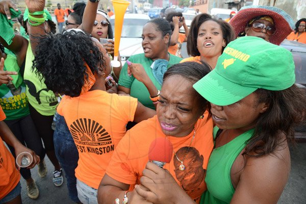 Rudolph Brown/Photographer
PNP and JLP supporters party after nomination on West and Beeston Street in West Kingston on Nomination Day on Tuesday, February 9, 2016