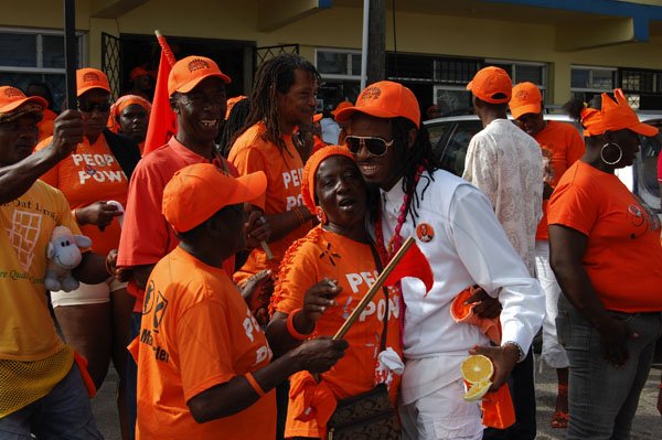Dave Lindo
Nomination Day - Central Manchester
La Lewis strikes a pose with some PNP supporters at the front of Peter Buntings Office Mandeville.