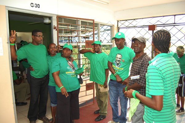 Dave Lindo
Nomination Day
Central Manchester
Members of JLP Central Manchester candidate Danville Walker outside of his post on Annex Plaza in Mandeville.