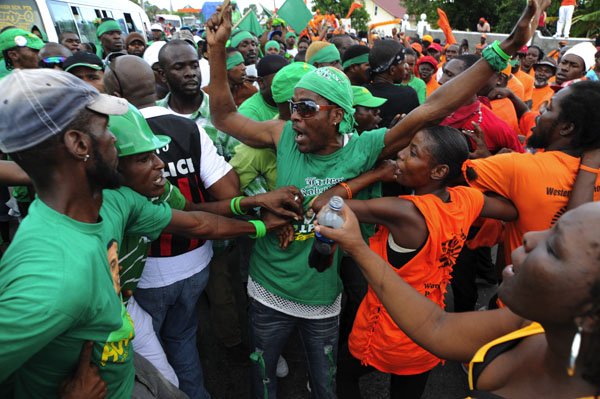 Ricardo Makyn/Staff Photographer
JLP and PNP supporters in Yallahs  Western St Thomas on Nomination Day on Monday 12.12.2011