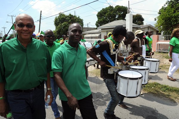 Norman Grindley / Chief Photographer
Jamaica Labour party (JLP) candidates vernon McLoud, (left) and Audley Gordon, heading to the Pembroke Hall nomination centre in St. Andrew yesterday.