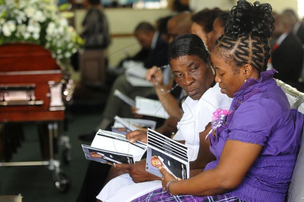 Gladstone Taylor / Photography

cousins Annmarie Lewis (right) and Icylyn Stewart (left) s seen at the thanks giving service for the life of Onel Williams