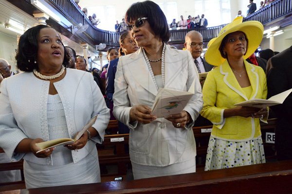 Rudolph Brown/Photographer
From left Natalie Neita Headley, Prime Minister Portia Simpson Miller and Sonia Fuller at the service of thanksgiving for the 140th Anniversary of the City of Kingston and The Achievements of the London 2012 Olympians and Paralympians " Repairing the Breach, Restoring the Treasure" at the East Queen Street Baptist Church on East Queen Street in Kingston on Sunday, October 14, 2012