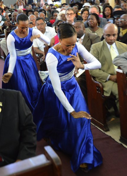 Rudolph Brown/Photographer
Karen Seymore Johnson, front and Michelle Salmon dancing at the service of thanksgiving for the 140th Anniversary of the City of Kingston and The Achievements of the London 2012 Olympians and Paralympians " Repairing the Breach, Restoring the Treasure" at the East Queen Street Baptist Church on East Queen Street in Kingston on Sunday, October 14, 2012