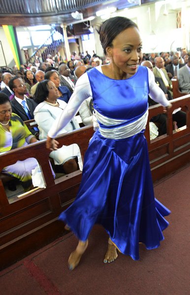 Rudolph Brown/Photographer
Karen Selmoe Johnson dancing at the service of thanksgiving for the 140th Anniversary of the City of Kingston and The Achievements of the London 2012 Olympians and Paralympians " Repairing the Breach, Restoring the Treasure" at the East Queen Street Baptist Church on East Queen Street in Kingston on Sunday, October 14, 2012