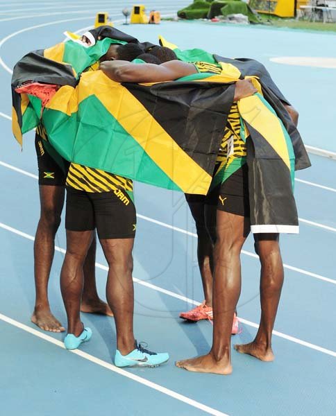 MY PHOTO CAPTION:
Winning Caption: "Together we came, together we saw and together we conquered."
- Jones-Stargirl Sherice 
The Gleaner has over the course of the nine-day, IAAF World Championships in Athletics provided a photograph in need of a caption, from Staff Photographer Ricardo Makyn. Enjoy this last photo, for caption from the Championship.