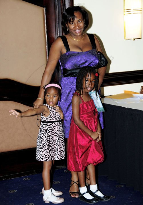 Winston Sill / Freelance Photographer
Klao Bell-Lewis and her daughters Tsenaye (left) and Gianna Lewis are out to mingle with the press. 

*****************************************************************
The Press Association of Jamaica (PAJ) presents the National Journalism Awards Banquet, held at the Jamaica Pegasus Hotel, New Kingston on Friday night December 2, 2011.