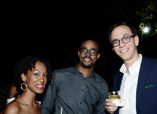 Winston Sill/Freelance Photographer
From left: Brittany Singh, Bazil Williams and Adam Moss smile for the camera at Pan Jamaican Investment Trust Limited Holiday Soiree.