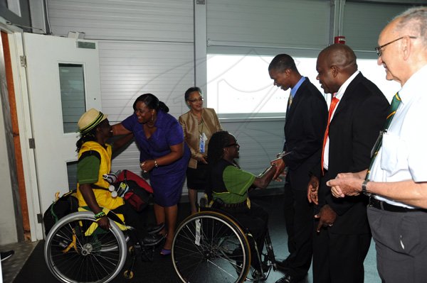 Norman Grindley/Chief Photographer
The Jamaica paralympic Association team arrives at the Norman international airport in Kingston yesterday.