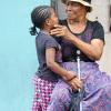 Jermaine Barnaby/Photographer
This senior citizen was seen with a little girl along Main Street in St Ann's Bay during a tour of parish capital, St Ann's Bay on Saturday March 21, 2014.