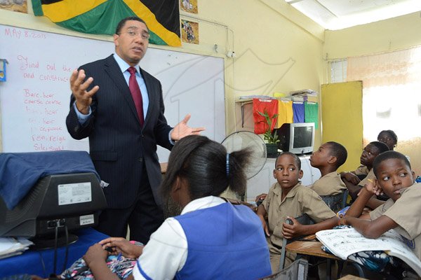 Rudolph Brown/Photographer
Opposition Leader Mr. Andrew Holness speaking to grade seven four students on value and Attitude on Teachers' Day at Penwood High School on Rhoden Crescent in St. Andrew on Wednesday, May 8, 2013