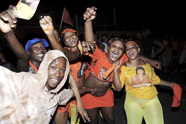 Norman Grindley/Chief Photographer
Supporters of the People's National  Party celebrate  at the office of Portia Simpson Miller's constituency office  on Waltham Park Road in South West St Andrew after the PNP's victory last night.