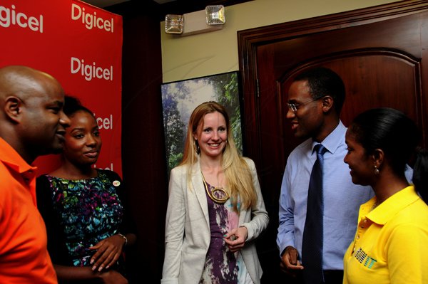 Winston Sill / Freelance Photographer
Arrival of The Royal Philharmonic Orchestra members, at Norman Manley International Airport on Monday September 10, 2012. Here are Julian Patrick (left), of NCB; Tahnida Nunes (second left), of Digicel; Ruth Currie (centre), Head of Community and Education, Royal Philharmonic Orchestra; Dr. Nigel Clarke (second right), Chairman, National Youth Orchestra of Jamaica; and Jackie Burrell-Clarke?? (right), of Digicel.