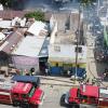 An aerial photograph of two fire trucks parked on Charles Street responding to a fire on Pink Lane on Tuesday May 26, 2020. The fire gutted five homes and damaged another three.