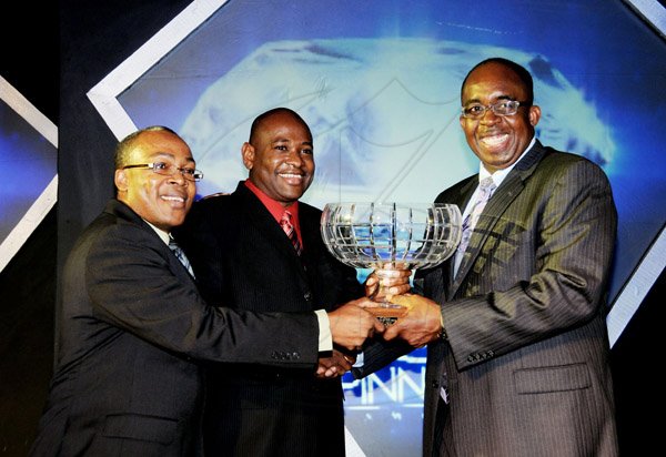 Winston Sill / Freelance Photographer
National Commercial Bank (NCB) the 11th annual Pinnacle Awards Dinner, held at the Jamaica Pegasus Hotel, New Kingston on Saturday night April 6, 2013. Here Patrick Hylton (right), Group Managing Director presents the Branch of the Year Award to Wayne Hunter (centre), outgoing Manager; and Laurie Spence (left), current Manager of St. Jago Branch.