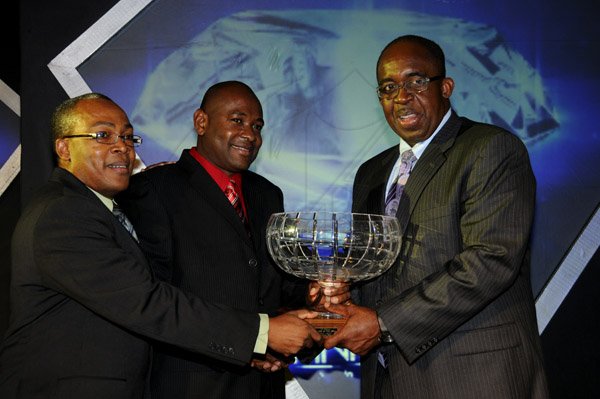 Winston Sill / Freelance Photographer
National Commercial Bank (NCB) the 11th annual Pinnacle Awards Dinner, held at the Jamaica Pegasus Hotel, New Kingston on Saturday night April 6, 2013. Here Patrick Hylton (right), Group Managing Director presents the Branch of the Yaer Award to Wayne Hunter (centre), outgoing Manager; and Laurie Spence (left), current Manager of St. Jago Branch.