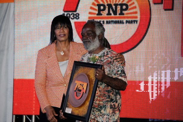 Winston Sill/Freelance Photographer
The Peioles National Party (PNP) 75th Anniversary National Gala and Awards Ceremony, held at Caymanas Golf Club, St. Catherine on Tuesday night September 17, 2013. Here are Prime Minister Portia Simpson-Miller (left); present  Owen Dave Allen (right) with the President Award.
