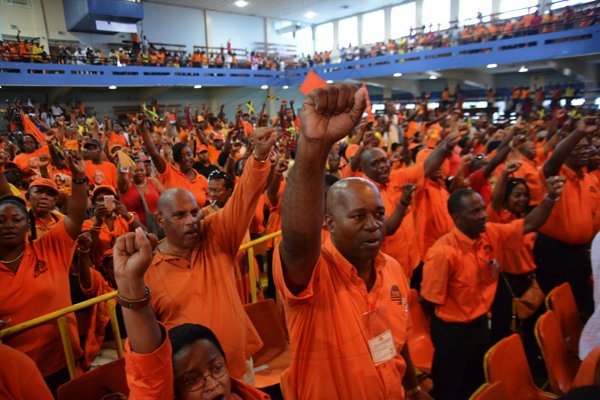 Rudolph Brown/Photographer
Comrades raise the fist at the PNP's 74th Annual Conference 2012 at National Arena in Kingston on Sunday, September 16-2012