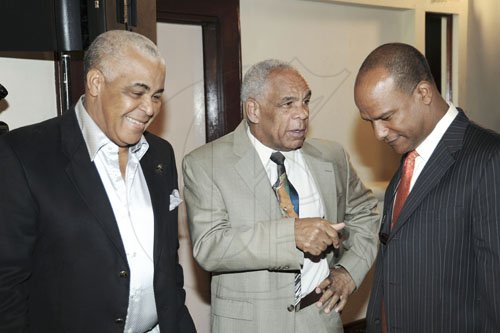 Norman Grindley/Chief Photographer
People's National Party (PNP) Chairman, Robert Pickersgill (left) with Chairman of the Manifesto Committee, Dr. Omar Davies (centre) and General Secretary Peter Bunting following rthe launch of the party's 2011 policy manual at the Wyndham hotel, New Kingston on Wednesday.