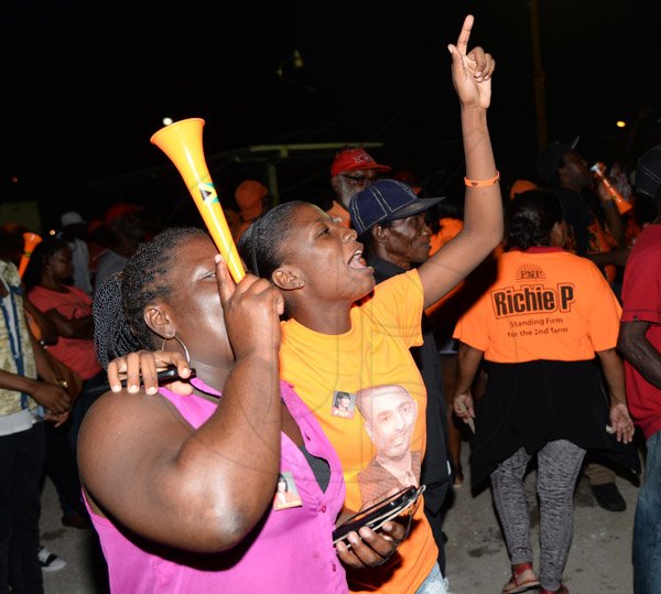Jermaine Barnaby/Photographer
A PNP supporters blowing a vuvuzela at the rally in Black River, St. Elizabeth on Sunday November 22, 2015.