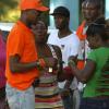Ian Allen/Photographer
A lone JLP supporter among  PNP supporters while the PNP motorcade tour Gibbs Hill in St.Mary on wednesday.