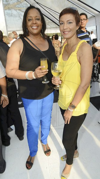 Rudolph Brown/Photographer
Marcia Erskin, (left) and Lystra Sharpe at Scotia Private Client Group Jamaica Open Polo tournament at Caymanas Estate on Sunday, March 10-2013.
