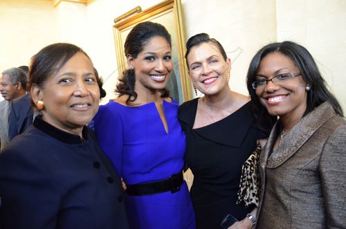 Rudolph Brown/Photographer
From left Mrs Hanna, Minister Lisa Hanna, Cindy Breakspear and Tishan Lee after Governor General Sir Patrick Allen swearing the Portia Simpson Miller cabinet ministers at Kingston House on Friday, January 6-2012