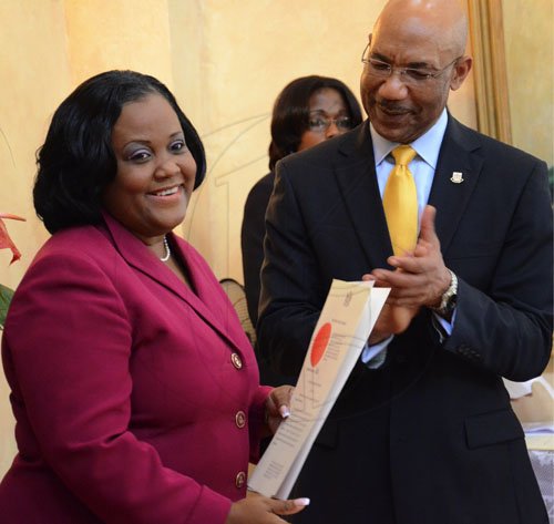 Rudolph Brown/Photographer
Governor General Sir Patrick Allen swearing the Portia Simpson Miller cabinet ministers at Kingston House on Friday, January 6-2012