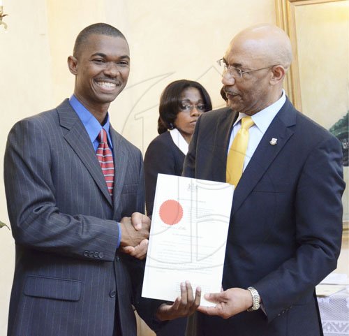 Rudolph Brown/Photographer
Governor General Sir Patrick Allen swearing the Portia Simpson Miller cabinet ministers at Kingston House on Friday, January 6-2012