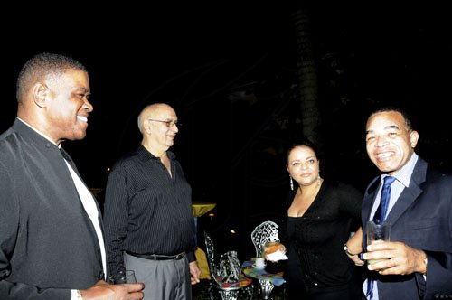 Winston Sill / Freelance Photographer
Michael Willacy (right) holds court with (from left) Steve Ashley, Sameer Younis and Sandrea Falconer.





Portia Simpson-Miller Foundation annual fundraising party, held at Norbrook Drive, St. Andrew on Friday night November 18, 2011.  (second right); and