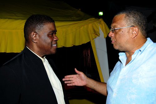 Winston Sill / Freelance Photographer
Portia Simpson-Miller Foundation annual fundraising party, held at Norbrook Drive, St. Andrew on Friday night November 18, 2011. Here are Steve Ashley (left); and Dr. Peter Phillips (right).