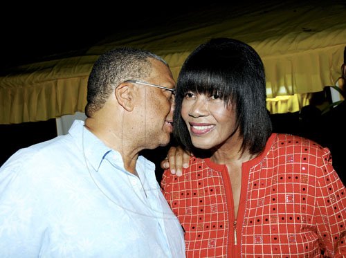 Winston Sill / Freelance Photographer
Portia Simpson-Miller Foundation annual fundraising party, held at Norbrook Drive, St. Andrew on Friday night November 18, 2011. Here are Dr. Peter Phillips (left); and Portia Simpson-Miller (right).