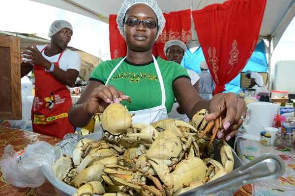 Rudolph Brown/Photographer
Andree Thompson of Rail's with her crabs at the Best Dressed Chicken Portland Jerk Festival at Folly Ruins in Portland on Sunday, July 7, 2013
