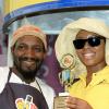 Rudolph Brown/Photographer
Nikolette Williams, branch promotions officer of Best Dressed presents the winning trophy to Malik Martin of Royal Maroon at the Best Dressed Chicken Portland Jerk Festival at Folly Ruins in Portland on Sunday, July 7, 2013