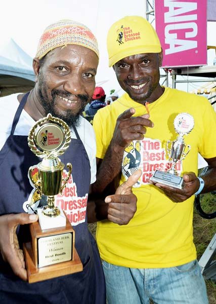 Rudolph Brown/Photographer
Malik Martin, (left) 1st place winner of Royal Maroon and 2nd runner up David Graham pose with winning trophy at the Best Dressed Chicken Portland Jerk Festival at Folly Ruins in Portland on Sunday, July 7, 2013
