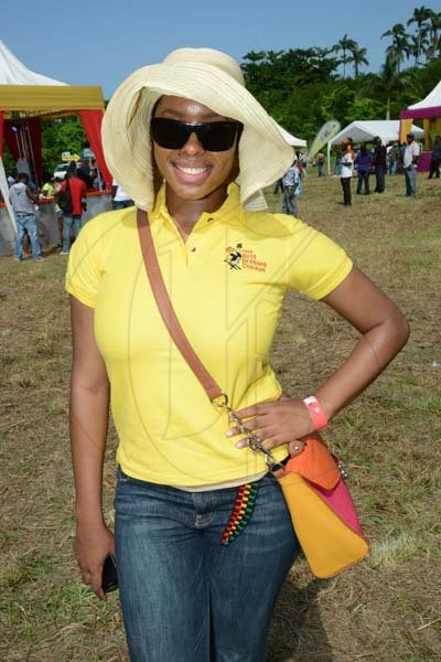Rudolph Brown/Photographer
Nikolette Williams, branch promotions officer of Best Dressed pose at the Best Dressed Chicken Portland Jerk Festival at Folly Ruins in Portland on Sunday, July 7, 2013