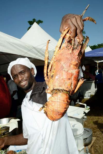 Rudolph Brown/Photographer
Dennis Haye show off his enormous lobber at the Best Dressed Chicken Portland Jerk Festival at Folly Ruins in Portland on Sunday




.............................................................................., July 7, 2013