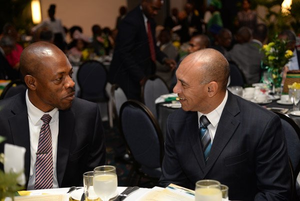 Jermaine Barnaby/Photographer
Dr. Carl Williams (left) Commissioner of Police and Major General Antony Bertram Anderson Chief of Defence Staff having a light moment at the annual National Leadership Prayer Breakfast at the Jamaica Pegasus Hotel in New Kingston on Thursday, January 21, 2016.