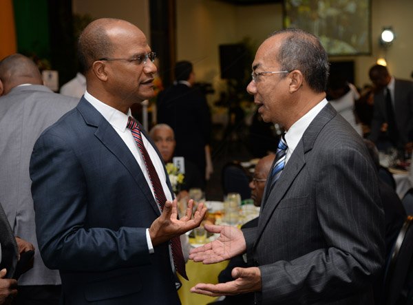 Jermaine Barnaby/Photographer
Peter Bunting (left) and Horace Chang making a point to each other at the annual National Leadership Prayer Breakfast at the  Jamaica Pegasus Hotel in New Kingston on Thursday, January 21, 2016.