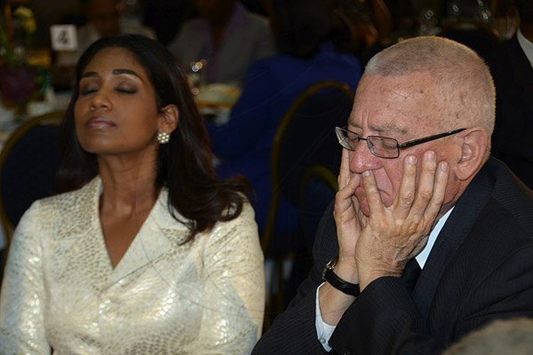 Ian Allen/Photographer
Minister of Youth and Culture Lisa Hanna left and Ronald Thwaites right, Minister of Education, praying during the National Prayer Breakfast 2013 at the Jamaica Pegasus Hotel in Kingston Thursday.