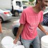 Rudolph Brown/PhotographerThis man leaving with his buckets he buy from the Super Valu Home Centre in Liguanea in preparation for Hurricane Matthew on Saturday, October 1, 2016